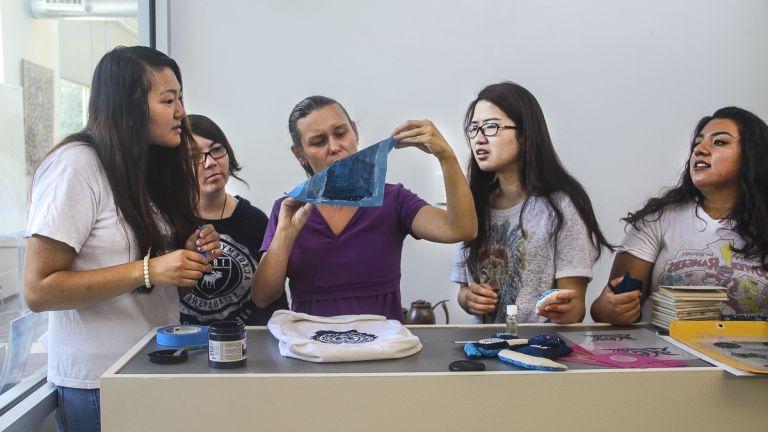 Professor demonstrating silk screen process