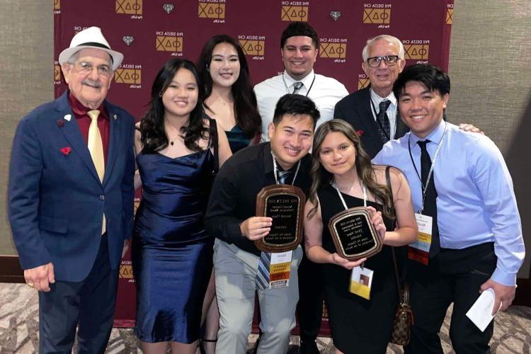 Students and alumni members of the Alpha Psi chapter of Phi Delta Chi