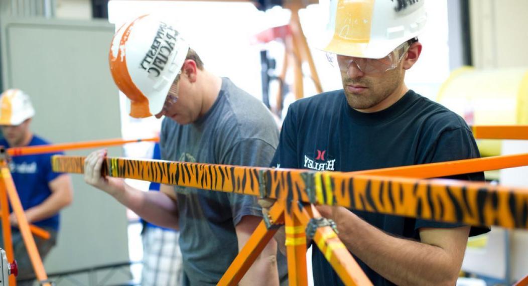 Students building a bridge. 