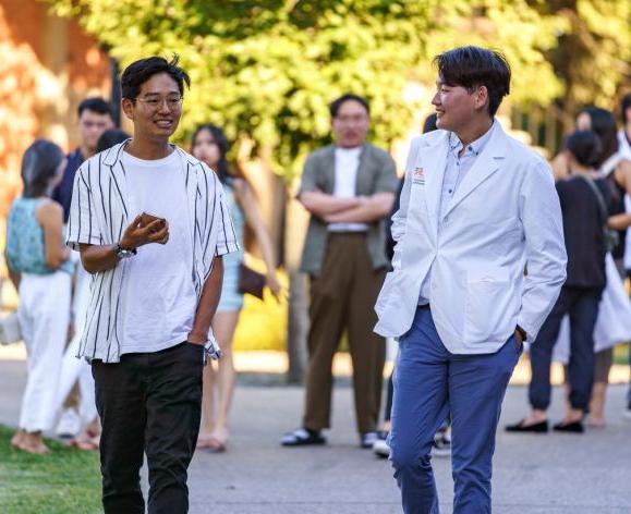 Two students walking on campus